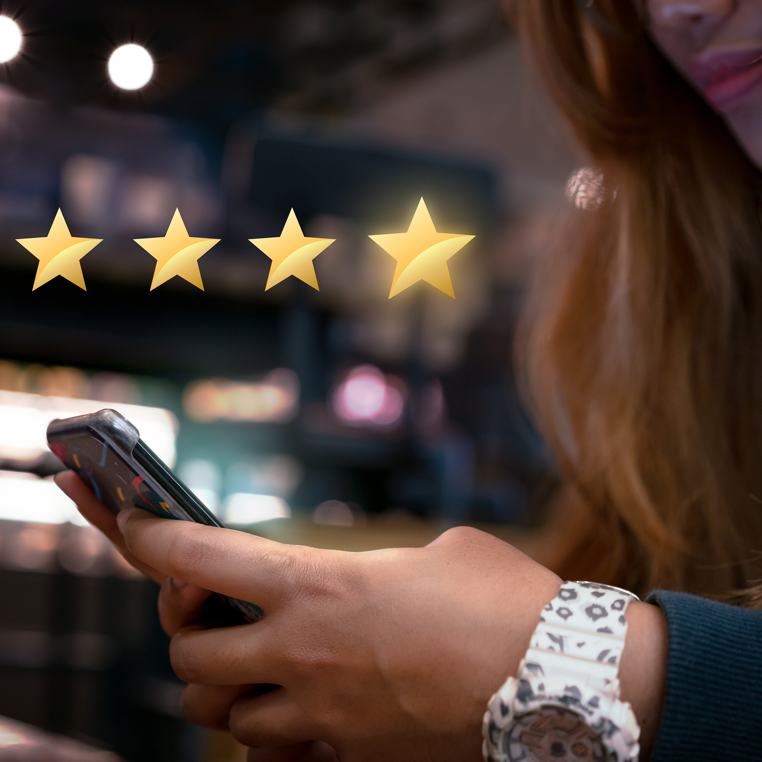 Millennial woman submitting star rating feedback on mobile device after internet shopping experience
