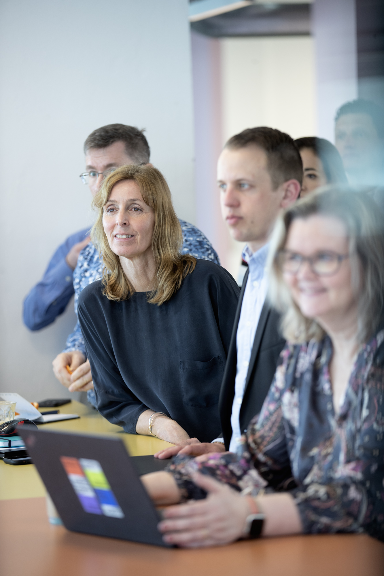 People around table during a presentation