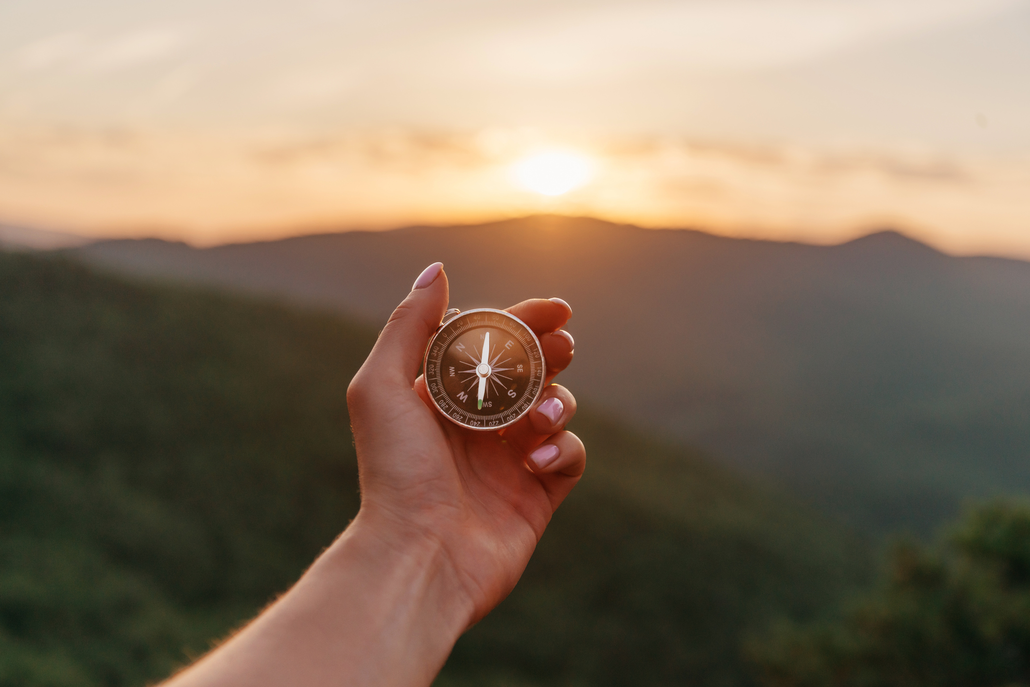 Female hand with compass