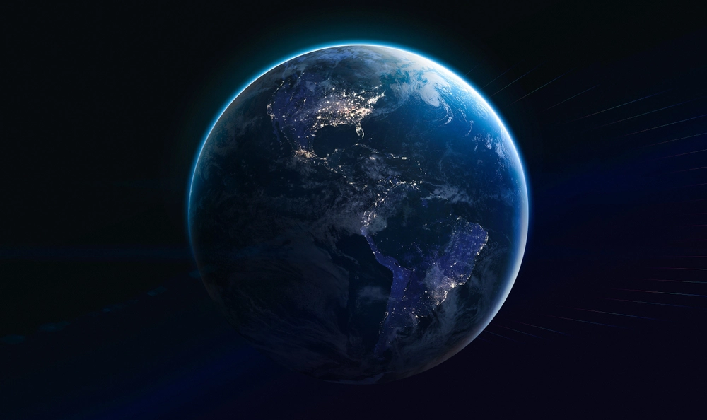the earth seen from space, glowing against the surrounding darkness
